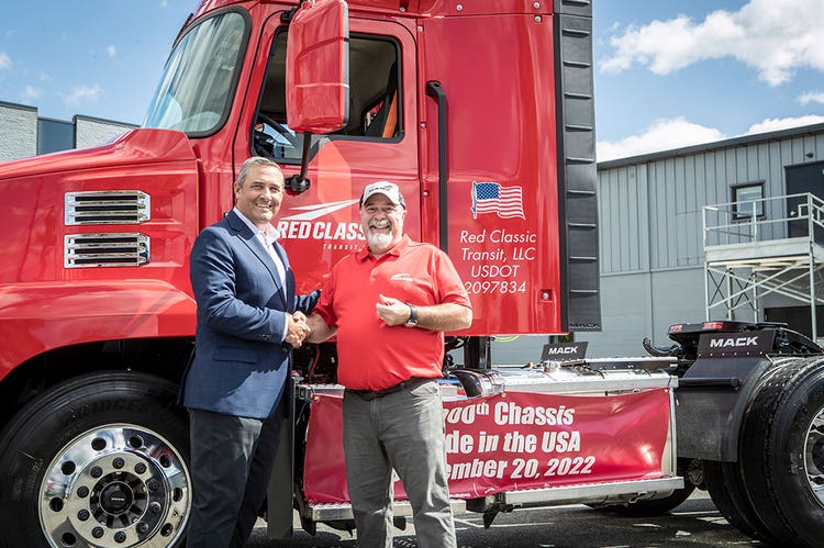 Spencer Webster, president of Red Classic hands over keys to a Mack® Anthem to driver Steve Coleman