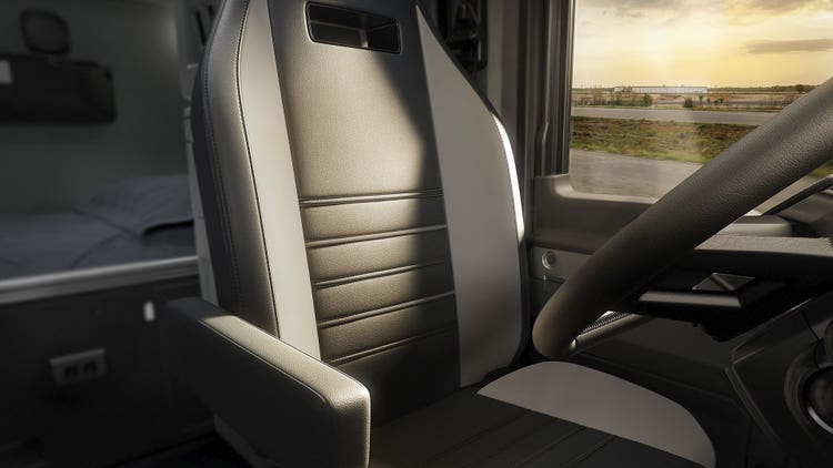 Interior view of a Mack truck showcasing a premium driver's seat
